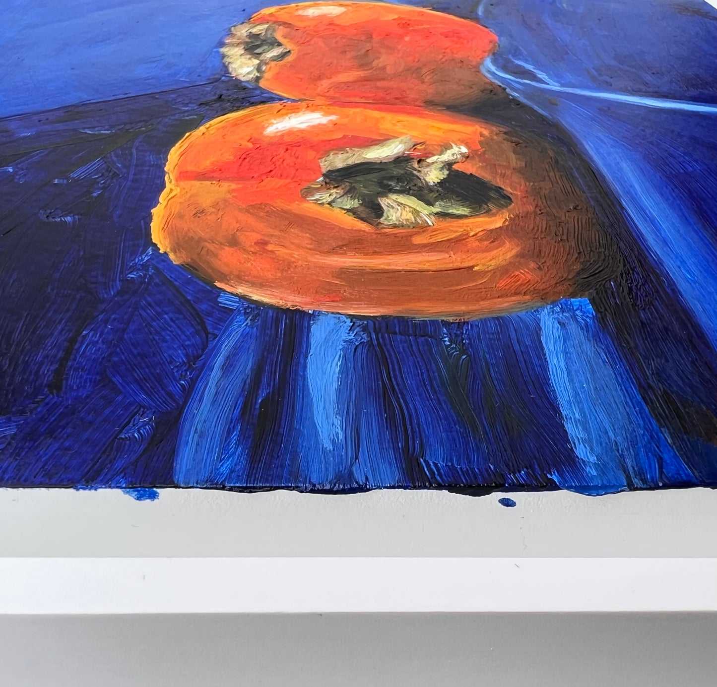 Persimmons on royal blue