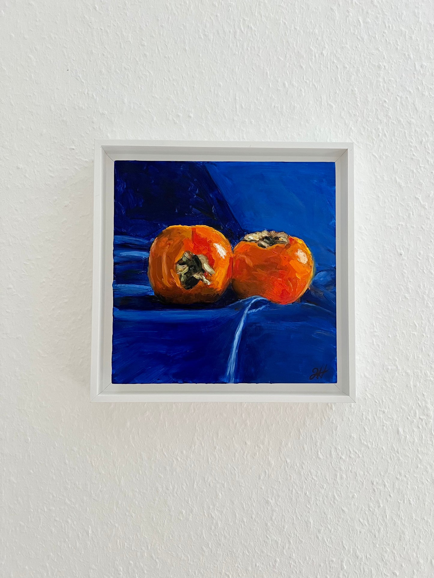 Persimmons on royal blue