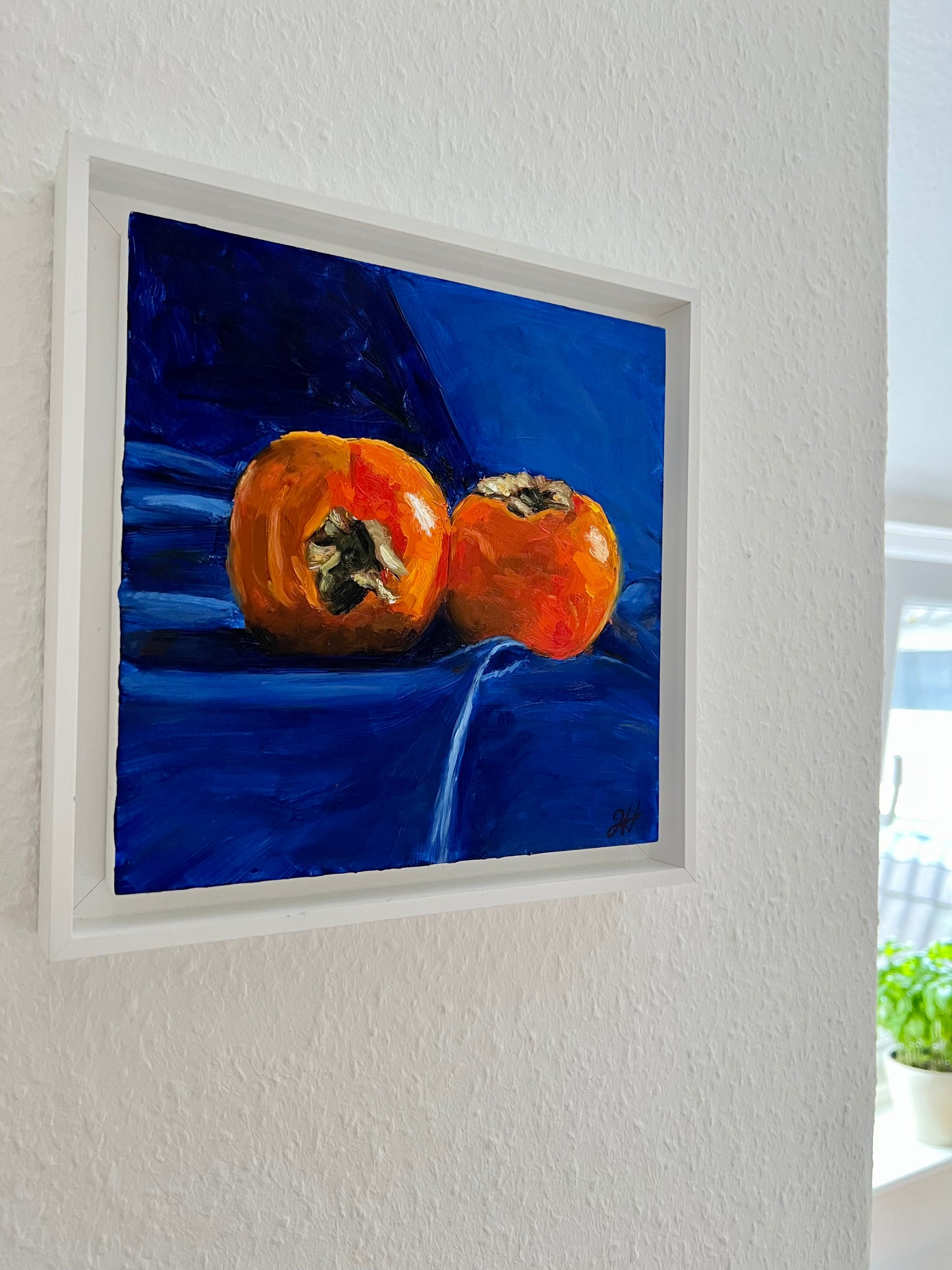 Persimmons on royal blue